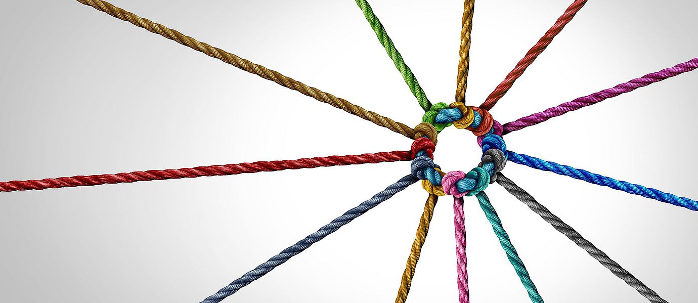 Interconnected yarn strands symbolizing the relationships between Rieter and spinning mills worldwide.