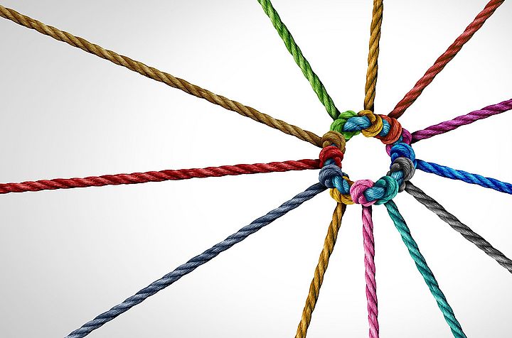 Interconnected yarn strands symbolizing the relationships between Rieter and spinning mills worldwide.