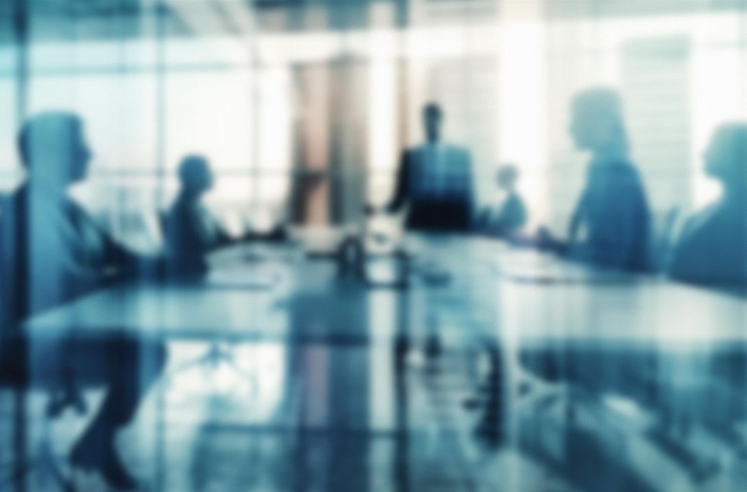 Group of managers in a meeting room (symbol)